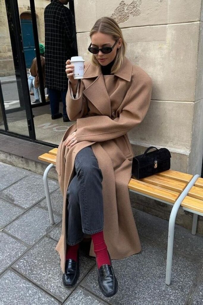 Savette Symmetry Pochette styled by women across different looks, demonstrating its minimalist luxury and wearable structure.