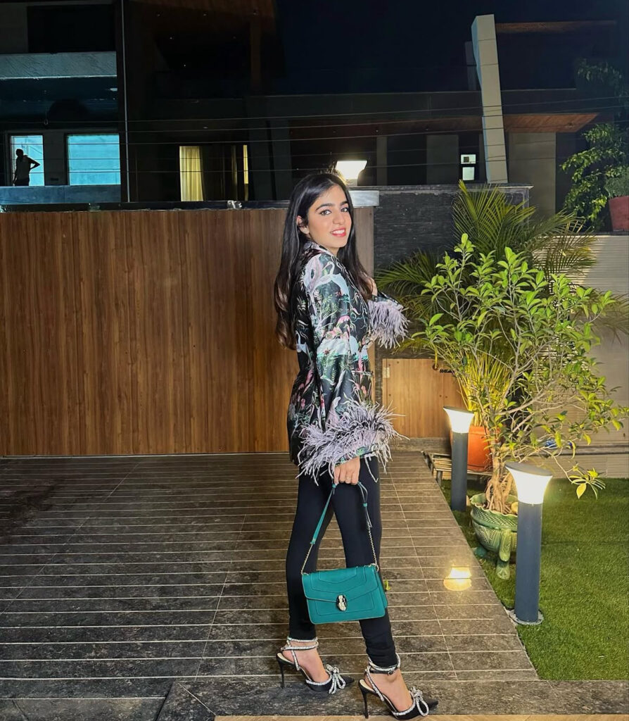 Woman styling an authentic Bvlgari Serpenti bag rented & verified Serpenti bag from SWRL