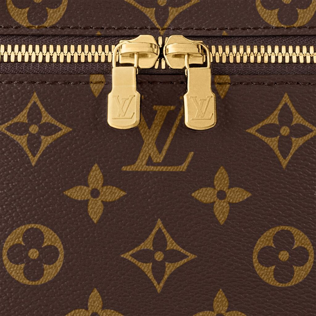 Close-up detail of the classic Louis Vuitton monogram canvas pattern and floral motifs
